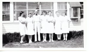 Jim and Marguerite Sumpter standing in front of Friendly Farm Restaurant with some of their wait staff circa 1940s.X2012.018.0112.002
